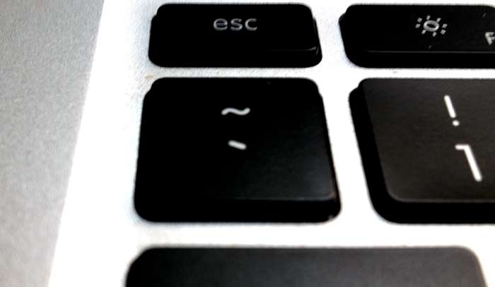 The backtick key, typically located at the top-left of the keyboard